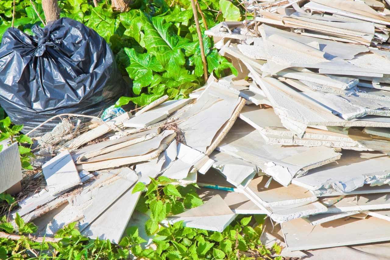 Illegal dumping of demolished plasterboard abandoned in nature